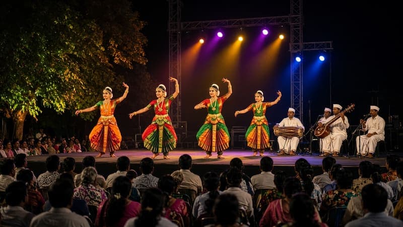 Classical dancers performing on a lit outdoor stage